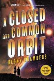 Book cover for "A Closed and Common Orbit" by Becky Chambers. The title is set in large extruded three-dimensional letters shading from white to gold, tilted across the face of a vast amber and violet planet lit by a bright distant sun; two figures stand silhouetted on a dark ridge along the bottom edge, with a gold roundel reading "Winner of the Hugo Award for Best Series" at the lower right.